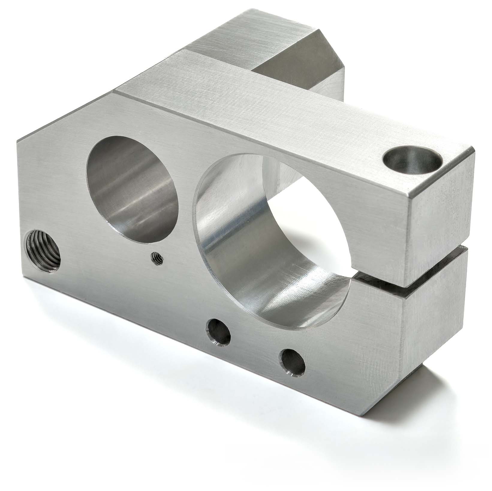 CNC machined aluminum block with central bore and clamping section
